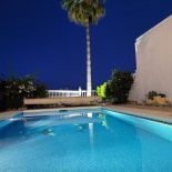 Mijas Villa pool and palm tree at night